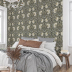 Bedroom styled with William Morris Pimpernel wallpaper in Sage & Cream on Ebony behind the bed.