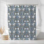 William Morris shower curtain with a blue and white Pimpernel floral pattern in a bathroom setting