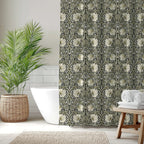 Bathroom with a classic William Morris shower curtain in sage and cream on ebony, a plant, and towels.