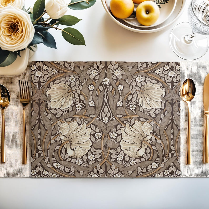 William Morris Pimpernel placemat in Rich Cocoa styled on a dining table with florals and place setting