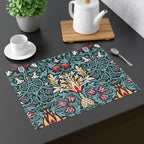 William Morris Snakeshead placemat in Teal & Garnet set on a dining table with tableware.