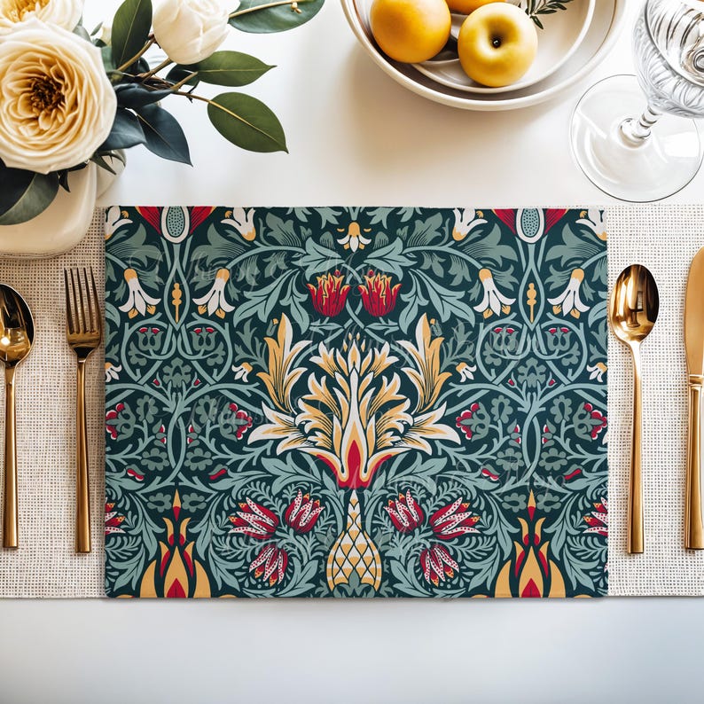 William Morris Snakeshead placemat in Teal & Garnet styled on a dining table with florals and a place setting.