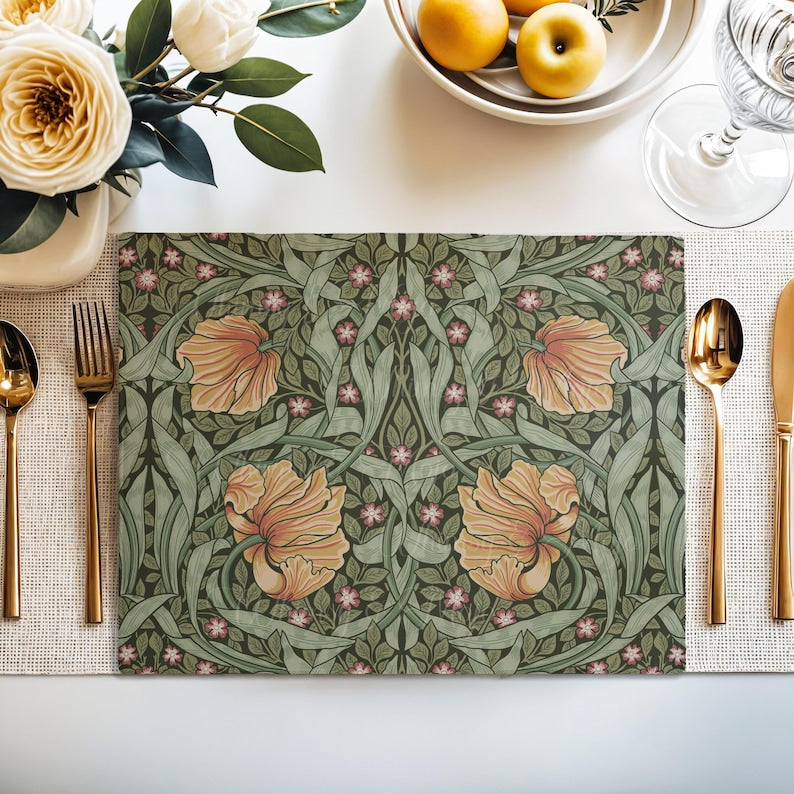 William Morris Pimpernel placemat styled on a dining table with florals and place setting
