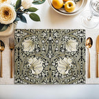 William Morris Pimpernel placemat in Khaki Sage styled on a dining table with florals and place setting