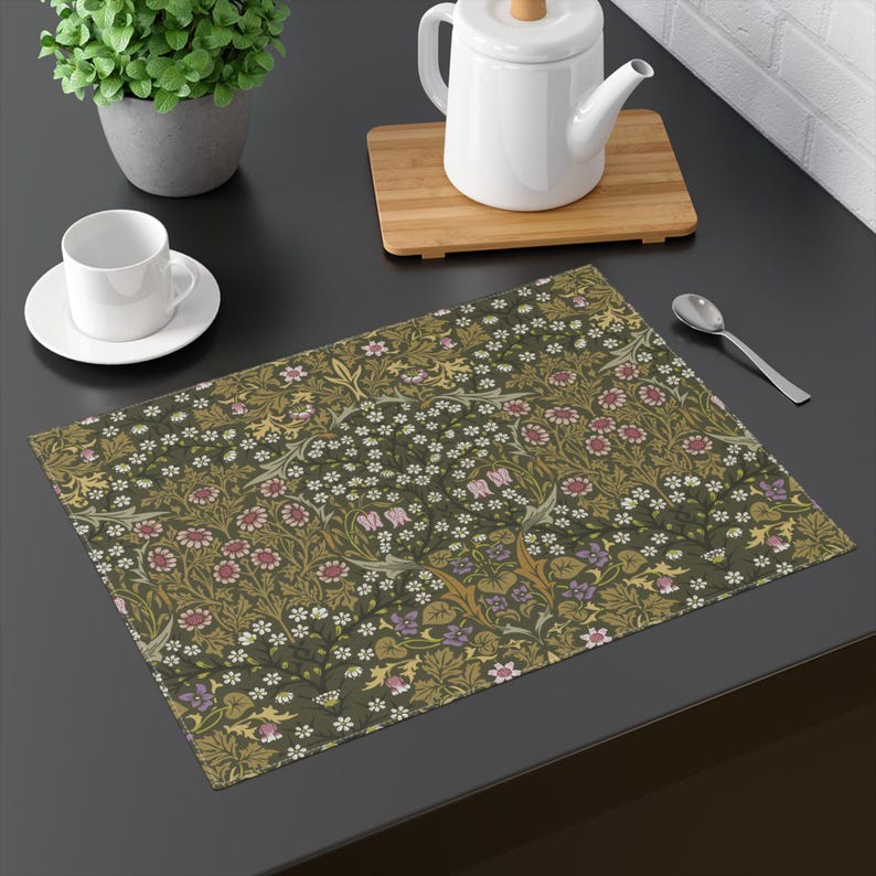 William Morris Blackthorn placemat in Olive Green set on a dining table with tableware